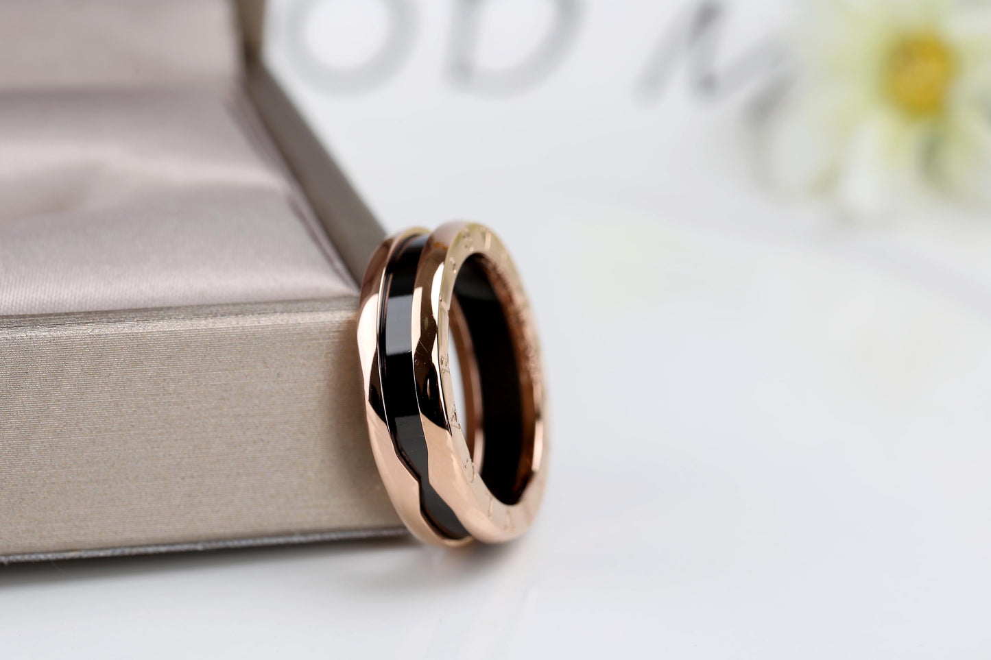 B.zero1 two-band ring with two 18 kt rose gold loops and a black ceramic spiral.